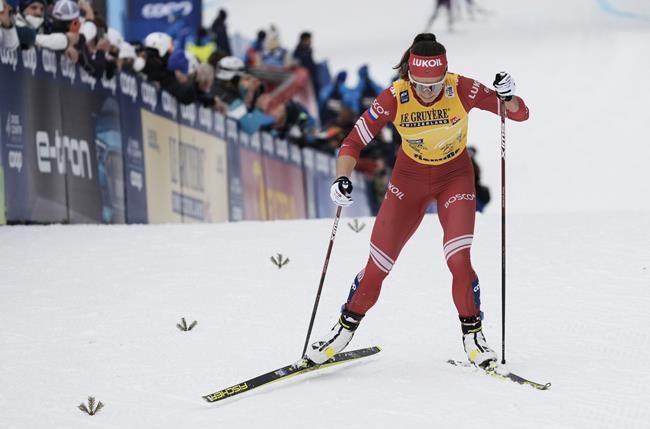 FILE - Russia's Natalia Nepryaeva participates during the women's mass start free 10km event at the Tour de Ski in Val di Fiemme, Trento, Italy, Jan. 4, 2022. Nepryaeva is showing strong form after taking the gold in the six-stage FIS Tour de Ski, which started in Switzerland, moved to Germany and concluded with a climb up an Alpine ski slope in Italy. (AP Photo/Giovanni Auletta, File)