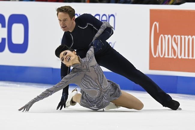 Madison Chock and Even Bates compete in the ice dance program during the U.S. Figure Skating Championships Saturday, Jan. 8, 2022, in Nashville, Tenn. (AP Photo/Mark Zaleski)