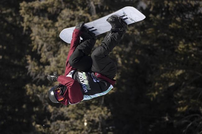 FILE - Shaun White, of the United States, executes a trick in the snowboarding halfpipe finals, Sunday, Dec. 19, 2021, during the Dew Tour at Copper Mountain, Colo. Shaun White is likely heading to the Olympics for a fifth time. For the first time, the snowboarding star and three-time gold medalist on the halfpipe won't be the favorite. (AP Photo/Hugh Carey, File)