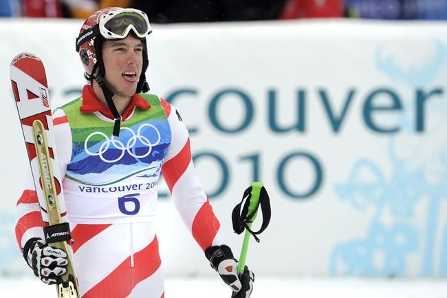 FILE - Switzerland's Carlo Janka reacts after winning the gold medal in the men's giant slalom at the Vancouver 2010 Olympics in Whistler, British Columbia, on Feb. 23, 2010. Once crowned the world's best all-around men's Alpine skier, Swiss racer Carlo Janka ended his racing career Thursday at his home country's most storied venue. Janka's career peaked in 2010 when he was the overall World Cup champion, gold medalist in giant slalom at the Vancouver Olympics and winner of the Lauberhorn downhill at Wengen that is mythic in Switzerland's sports history. (AP Photo/Gero Breloer, File)
