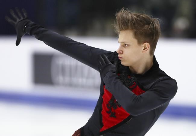 Evgeni Semenenko of Russia performs his men's free skating during the ISU European Figure Skating Championships in Tallinn, Estonia, Friday, Jan. 14, 2022. (AP Photo/Raul Mee)