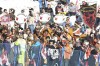 Fans attend an alpine ski, men's World Cup downhill race, in Wengen, Switzerland, Saturday, Jan. 15, 2022. (AP Photo/Luciano Bisi)