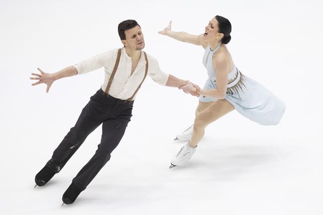 Charlene Guignard and Marco Fabbri of Italy perform during ice dance free dance competition of the ISU European Figure Skating Championships in Tallinn, Estonia, Saturday, Jan. 15, 2022. (AP Photo/Raul Mee)