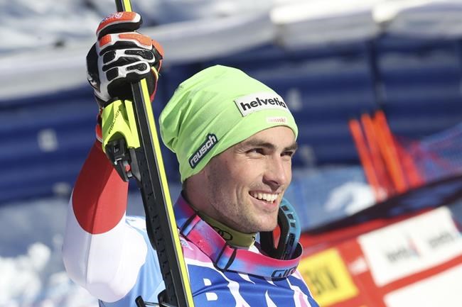 Switzerland's Daniel Yule celebrates taking second place in an alpine ski, men's World Cup slalom race, in Wengen, Switzerland, Sunday, Jan. 16, 2022. (AP Photo/Luciano Bisi)
