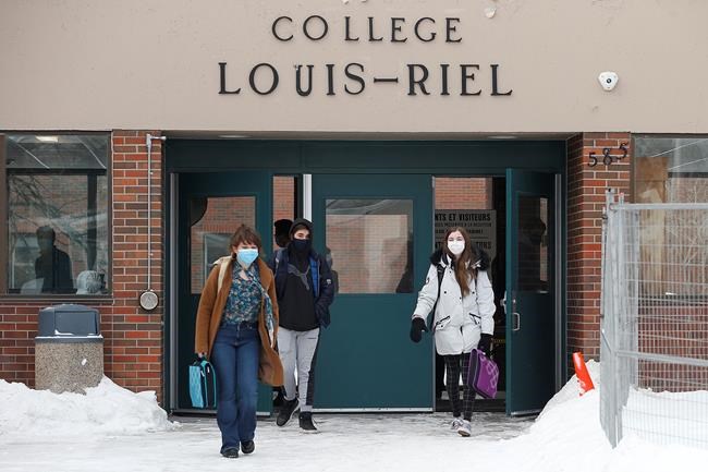 Some high school students at College Louis Riel walk out of class in Winnipeg on Monday, Jan. 17, 2022. Some students protested the return to school as COVID-19 numbers continue to rise in Manitoba. THE CANADIAN PRESS/John Woods