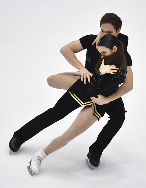 Caroline Green and Michael Parsons of USA perform their ice dance free dance skating program during the ISU Four Continents Figure Skating Championships in Tallinn, Estonia, Thursday, Jan. 20, 2022. (AP Photo/Sergei Stepanov)