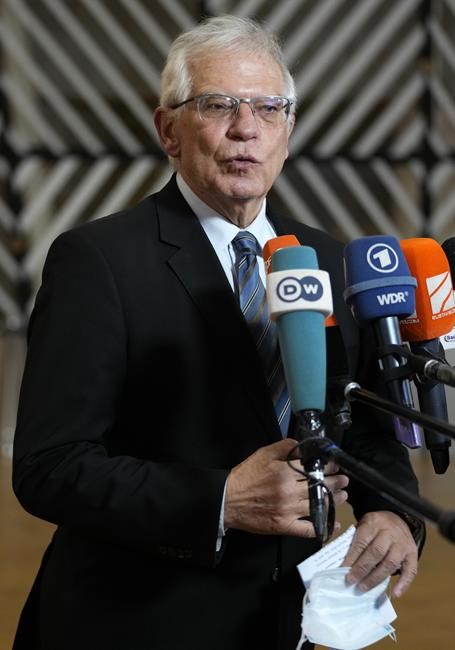 European Union foreign policy chief Josep Borrell speaks with the media as he arrives for a meeting of EU foreign ministers at the European Council building in Brussels, Monday, Jan. 24, 2022. European Union foreign ministers are aiming Monday to show a fresh display of resolve and unity in support of Ukraine, amid deep uncertainty about whether President Vladimir Putin intends to attack Russia's neighbor or send his troops across the border. (AP Photo/Virginia Mayo)