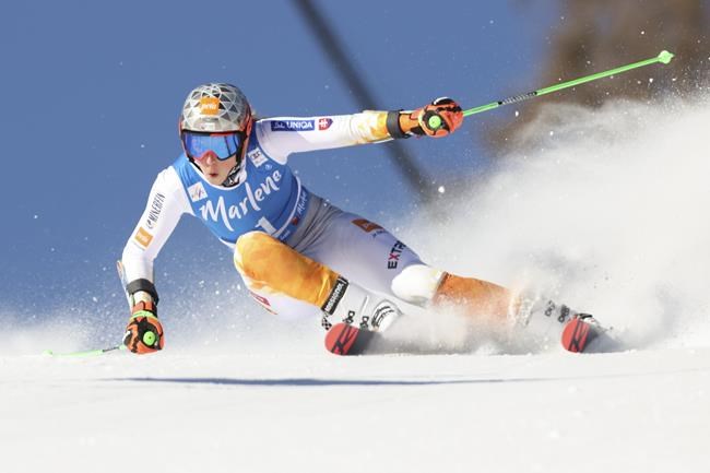 Slovakia's Petra Vlhova speeds down the course during the first run of an alpine ski, women's World Cup giant slalom, in Kronplatz, Italy, Tuesday, Jan. 25, 2022. (AP Photo/Alessandro Trovati)