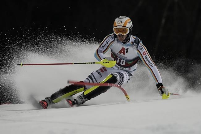 Germany's Linus Strasser speeds down the course during the first run of an alpine ski, men's World Cup slalom, in Schladming, Austria, Tuesday, Jan. 25, 2022. (AP Photo/Giovanni Auletta)