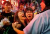 FILE - Protesters cry as the police officers try to stop them blocking the road in Mong Kok district of Hong Kong Wednesday Nov. 26, 2014. As Beijing prepares to hold the Winter Olympics opening in February 2022, China's president and party leader Xi Jinping appears firmly in control. The party has made political stability paramount and says that has been the foundation for the economic growth that has bettered lives and put the nation on a path to becoming a regional if not global power. (AP Photo/Kin Cheung, File)