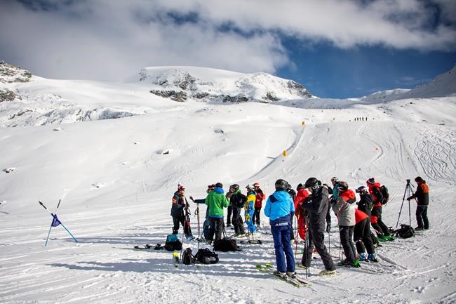 FILE - Didier Defago, former ski racer from Switzerland and designer of the slope, talks to journalists in the finish area of the new ski slope