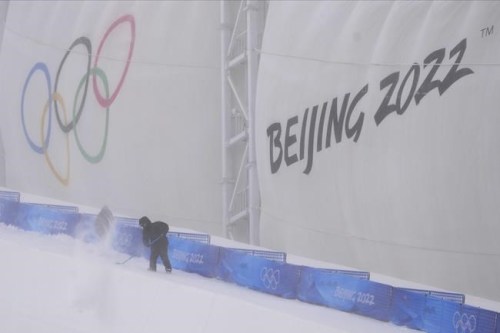 A worker shovels as he prepares for freestyle ski and snowboard events at Genting Snow Park prior to the 2022 Winter Olympics, Monday, Jan. 31, 2022, in Zhangjiakou, China.&nbsp;An international study led by a University of Waterloo researcher published findings last month, suggesting that if global emissions of greenhouse gases are not dramatically reduced, only one of the 21 previous Winter Games sites would be able to safely and viably host another Olympics by the end of this century. THE CANADIAN PRESS/AP-Lee Jin-man