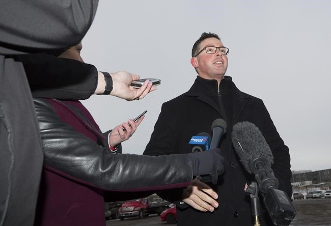 Alberta Justice Minister Doug Schweitzer makes a statement about the federal carbon tax at a news conference in Calgary on Tuesday, Dec. 31, 2019. Schweitzer, who is now jobs and the economy minister, says he wants answers from a fellow caucus member who attended a truck protest that is snarling traffic at the U.S. border. THE CANADIAN PRESS/Todd Korol