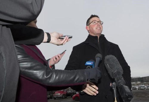 Alberta Justice Minister Doug Schweitzer makes a statement about the federal carbon tax at a news conference in Calgary on Tuesday, Dec. 31, 2019. Schweitzer, who is now jobs and the economy minister, says he wants answers from a fellow caucus member who attended a truck protest that is snarling traffic at the U.S. border. THE CANADIAN PRESS/Todd Korol