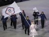 FILE - Lien Te-An, of Taiwan, carries a flag during the opening ceremony of the 2018 Winter Olympics in Pyeongchang, South Korea, Feb. 9, 2018. The four Taiwanese athletes competing in Beijing for the Winter Olympics, which open Friday, Feb. 4, 2022, can’t use Taiwan’s flag. They have long competed under a name, Chinese Taipei, that is rarely used and was forced on the team by a geopolitical divide that predates the Cold War. (AP Photo/Michael Sohn, File)