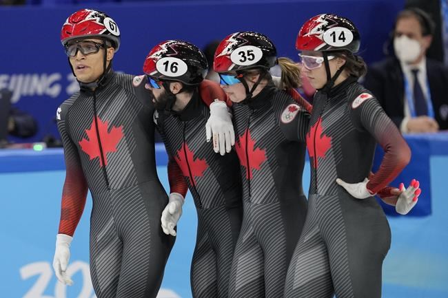 Team Canada react after the mixed team relay final during the short track speedskating competition at the 2022 Winter Olympics, Saturday, Feb. 5, 2022, in Beijing. (AP Photo/Natacha Pisarenko)