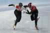 Shaolin Sandor Liu, left, of Hungary and Ren Ziwei of China, battle to cross the finish line in the final of the men's 1,000-meter during the short track speedskating competition at the 2022 Winter Olympics, Monday, Feb. 7, 2022, in Beijing. (AP Photo/Natacha Pisarenko)
