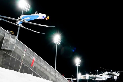 Peter Prevc, of Slovenia, soars through the air during the mixed team trial round at the 2022 Winter Olympics, Monday, Feb. 7, 2022, in Zhangjiakou, China. (AP Photo/Andrew Medichini)