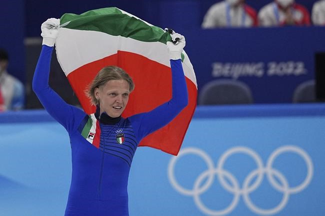 Arianna Fontana of Italy, celebrates after winning the final of the women's 500-meter during the short track speedskating competition at the 2022 Winter Olympics, Monday, Feb. 7, 2022, in Beijing. (AP Photo/David J. Phillip)
