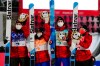 Mackenzie Boyd-Clowes, of Canada, left, celebrates with teammates Abigail Strate, second from left, Matthew Soukup, second from right, and Alexandria Loutitt after they won bronze in the ski jumping mixed team event at the 2022 Winter Olympics, Monday, Feb. 7, 2022, in Zhangjiakou, China. (AP Photo/Matthias Schrader)