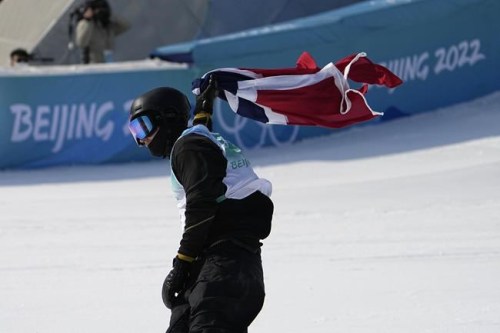 Birk Ruud of Norway celebrates after the men's freestyle skiing big air finals of the 2022 Winter Olympics, Wednesday, Feb. 9, 2022, in Beijing. (AP Photo/Jae C. Hong)