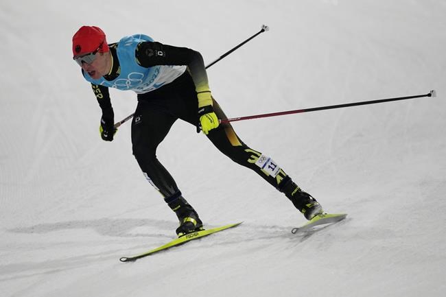Germany's Vinzenz Geiger competes during the cross-country skiing portion of the individual Gundersen normal hill/10km event at the 2022 Winter Olympics, Wednesday, Feb. 9, 2022, in Zhangjiakou, China. (AP Photo/Aaron Favila)