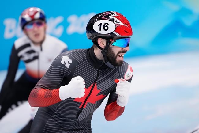 Canada's Steven Dubois reacts after winning the silver medal in the men's 1,500-metre short-track speedskating event at the Beijing Winter Olympics in Beijing, China, on Wednesday, Feb. 9, 2022. THE CANADIAN PRESS/Paul Chiasson