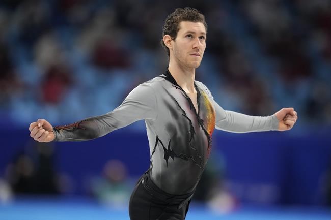 Jason Brown, of the United States, competes in the men's free skate program during the figure skating event at the 2022 Winter Olympics, Thursday, Feb. 10, 2022, in Beijing. (AP Photo/Natacha Pisarenko)
