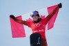 Canada's Meryeta O'Dine celebrates her bronze medal in the women's snowboard cross final at the 2022 Beijing Winter Olympics in Zhangjiakou, China on Wednesday, Feb. 9, 2022. THE CANADIAN PRESS/Sean Kilpatrick