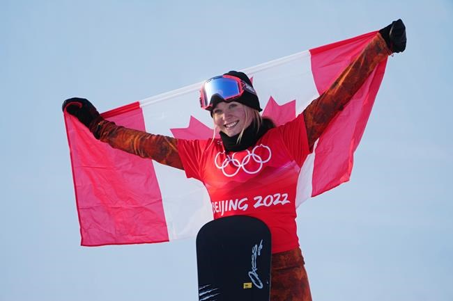 Canada's Meryeta O'Dine celebrates her bronze medal in the women's snowboard cross final at the 2022 Beijing Winter Olympics in Zhangjiakou, China on Wednesday, Feb. 9, 2022. THE CANADIAN PRESS/Sean Kilpatrick