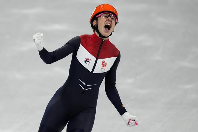 Suzanne Schulting of the Netherlands, reacts after winning the final of the women's 1000-meters during the short track speedskating competition at the 2022 Winter Olympics, Friday, Feb. 11, 2022, in Beijing. (AP Photo/Bernat Armangue)