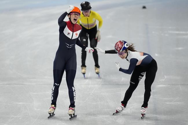 Suzanne Schulting of the Netherlands, reacts after winning the final of the women's 1000-meters during the short track speedskating competition at the 2022 Winter Olympics, Friday, Feb. 11, 2022, in Beijing. (AP Photo/Bernat Armangue)