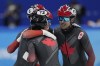 Team Canada celebrate after winning their men's 5000-meters relay semifinal during the short track speedskating competition at the 2022 Winter Olympics, Friday, Feb. 11, 2022, in Beijing. THE CANADIAN PRESS/AP Photo/David J. Phillip