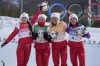 From left, Yulia Stupak, of the Russian Olympic Committee, Natalia Nepryaeva, Tatiana Sorina, and Veronika Stepanova celebrate after winning the gold medal during a venue ceremony after the women's 4 x 5km relay cross-country skiing competition at the 2022 Winter Olympics, Saturday, Feb. 12, 2022, in Zhangjiakou, China. (AP Photo/Aaron Favila)