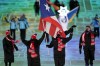 Kellie Delka and William C. Flaherty, of Puerto Rico, lead their team in during the opening ceremony of the 2022 Winter Olympics, Friday, Feb. 4, 2022, in Beijing. (AP Photo/David J. Phillip)