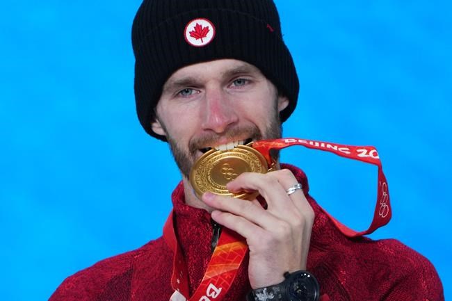 Canada's Max Parrot celebrates with his gold medal during the medal ceremony for men's snowboard slopestyle at the Beijing Winter Olympics in Zhangjiakou, China, on Monday, Feb. 7, 2022.The 27-year-old will chase a second Tuesday in big air. THE CANADIAN PRESS/Sean Kilpatrick