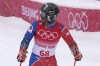 Richardson Viano, of Haiti looks back up the hill after finishing the first run of the men's giant slalom at the 2022 Winter Olympics, Sunday, Feb. 13, 2022, in the Yanqing district of Beijing. (AP Photo/Luca Bruno)
