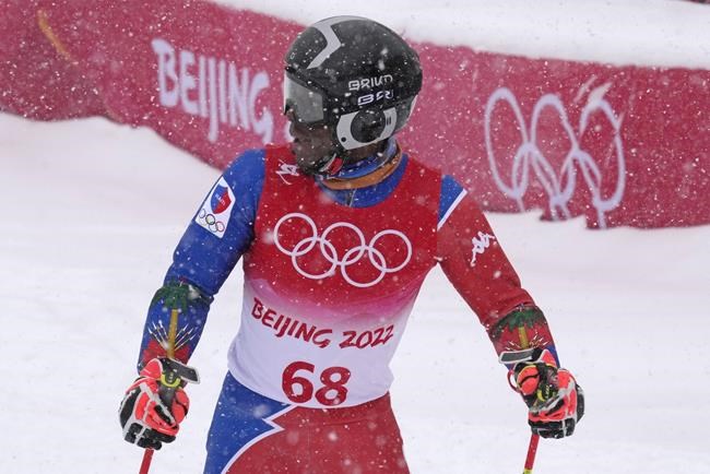 Richardson Viano, of Haiti looks back up the hill after finishing the first run of the men's giant slalom at the 2022 Winter Olympics, Sunday, Feb. 13, 2022, in the Yanqing district of Beijing. (AP Photo/Luca Bruno)
