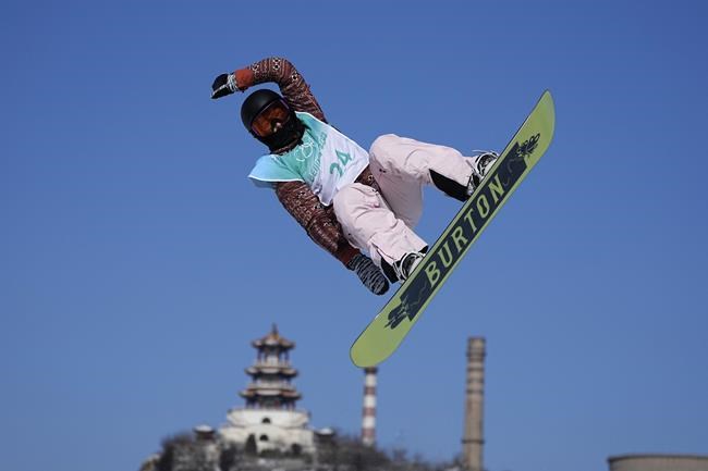 Ekaterina Kosova of the Russian Olympic Committee competes during the women's snowboard big air qualifications of the 2022 Winter Olympics, Monday, Feb. 14, 2022, in Beijing. (AP Photo/Ashley Landis)