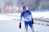 Quentin Fillon Maillet of France crosses the finish line in second during the men's 4x7.5-kilometer relay at the 2022 Winter Olympics, Tuesday, Feb. 15, 2022, in Zhangjiakou, China. (AP Photo/Kirsty Wigglesworth)