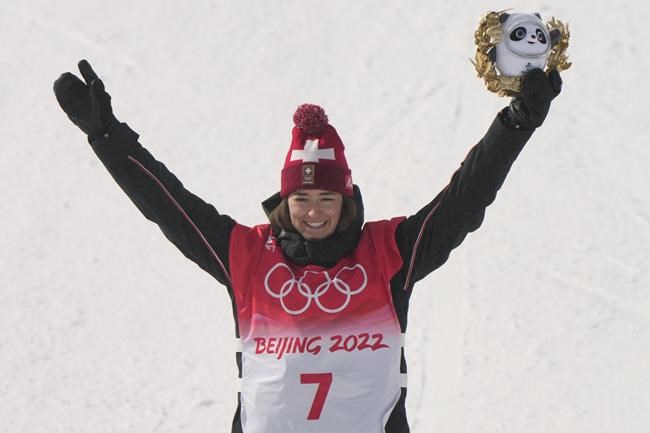 Gold medal winner Switzerland's Mathilde Gremaud celebrates during the venue award ceremony for the women's slopestyle finals at the 2022 Winter Olympics, Tuesday, Feb. 15, 2022, in Zhangjiakou, China. (AP Photo/Francisco Seco)