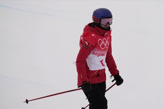 China's Eileen Gu competes during the women's halfpipe qualification at the 2022 Winter Olympics, Thursday, Feb. 17, 2022, in Zhangjiakou, China. (AP Photo/Francisco Seco)