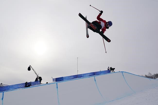 China's Eileen Gu compete during the women's halfpipe qualification at the 2022 Winter Olympics, Thursday, Feb. 17, 2022, in Zhangjiakou, China. (AP Photo/Gregory Bull)