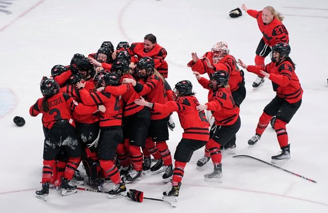 Team Canada celebrates after defeating the United States in women's hockey gold medal game action at the 2022 Winter Olympics in Beijing on Thursday, Feb. 17, 2022. THE CANADIAN PRESS/Paul Chiasson