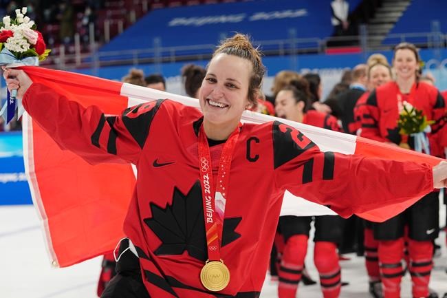 Team Canada forward Marie-Philip Poulin (29) celebrates with her gold medal after defeating the United States in women's hockey gold medal game action at the 2022 Winter Olympics in Beijing on Thursday, Feb. 17, 2022. Poulin and Canada reclaimed the gold medal with a 3-2 win over the United States. THE CANADIAN PRESS/Ryan Remiorz