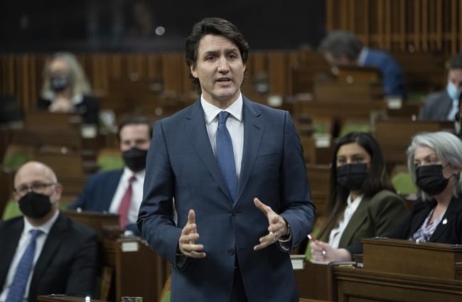 Prime Minister Justin Trudeau rises during Question Period in Ottawa, Monday, Feb. 21, 2022. THE CANADIAN PRESS/Adrian Wyld