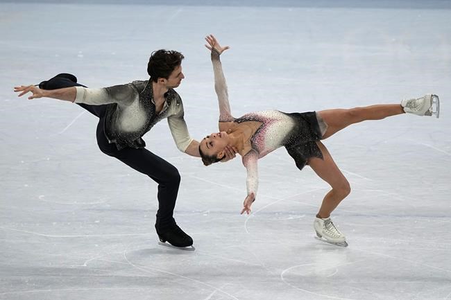 Laura Barquero and Marco Zandron, of Spain, compete in the pairs short program during the figure skating competition at the 2022 Winter Olympics, Friday, Feb. 18, 2022, in Beijing. (AP Photo/David J. Phillip)