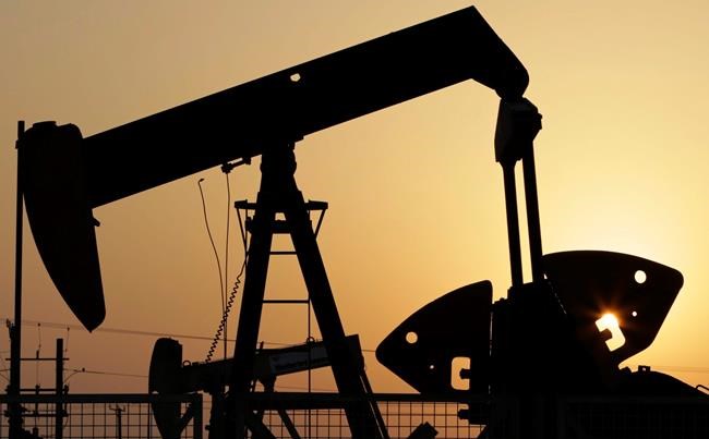 Oil pumps work in the desert oil fields of Sakhir, Bahrain. Sept. 30, 2015. Oil prices are rapidly heading toward US$100 a barrel, but analysts say the chances of crude smashing that threshold depends on what happens next in Ukraine. The potential for a war in Eastern Europe has made energy prices volatile. THE CANADIAN PRESS/AP-Hasan Jamali