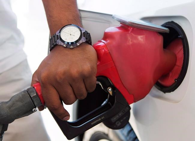 A person pumps fuel in Toronto after gasoline prices rose overnight on Wednesday, September 12, 2012. Russia’s attack on Ukraine is putting even greater pressure on an already surging oil price environment and that could cost Canadians more at the pump.THE CANADIAN PRESS/Michelle Siu