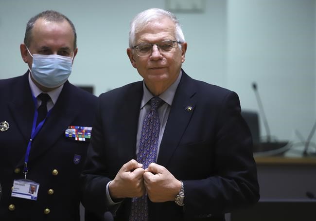 European Union foreign policy chief Josep Borrell, right, speaks with Director-General of the European Union Military Staff Herve Blejean during a meeting of EU foreign ministers in Brussels, Friday, Feb. 25, 2022. EU leaders, at a meeting on Thursday, agreed on further restrictive measures following Russia's military aggression against Ukraine. EU foreign affairs ministers meet in Brussels on Friday to proceed with the adoption of these restrictive measures. (AP Photo/Valeria Mongelli)